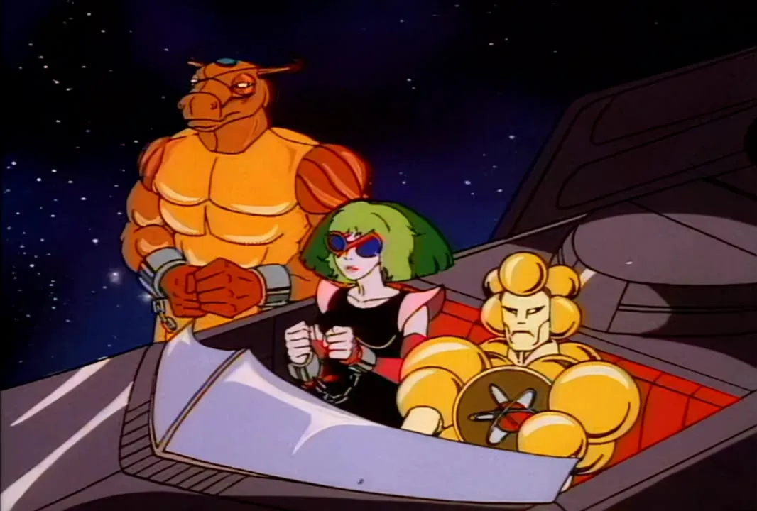 Mumbo Jumbo and Melodia, both in shackles, ride in a Mob car with Mo-Lec-U-Lar in the front seat.