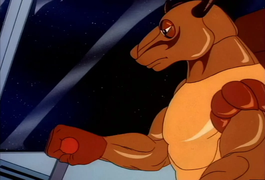 Mumbo Jumbo grips the controls in the Mob truck's cab as the SilverHawks close in.